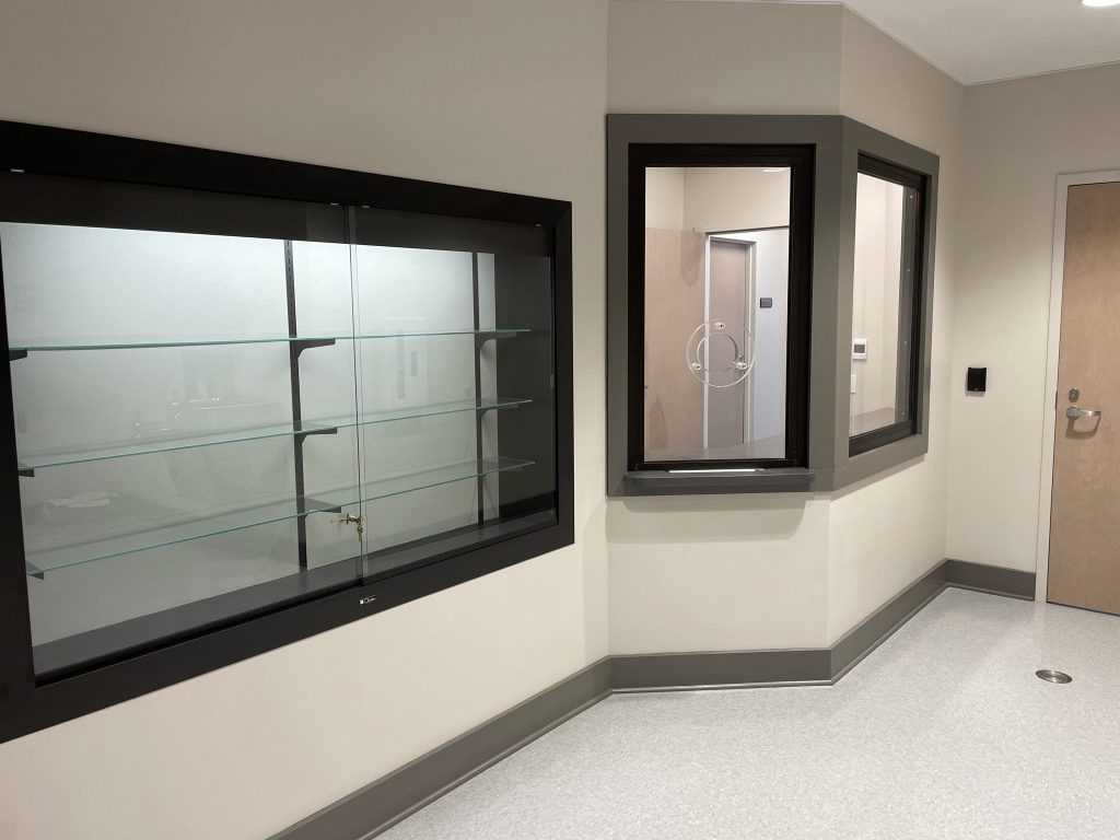 Display case and protected reception window. 