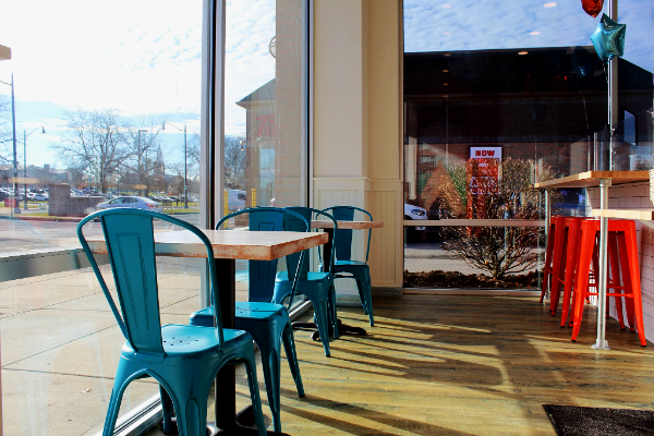 Interior dining space of Tropical Smoothie Café featuring seating and customer area constructed by Picone Construction.
