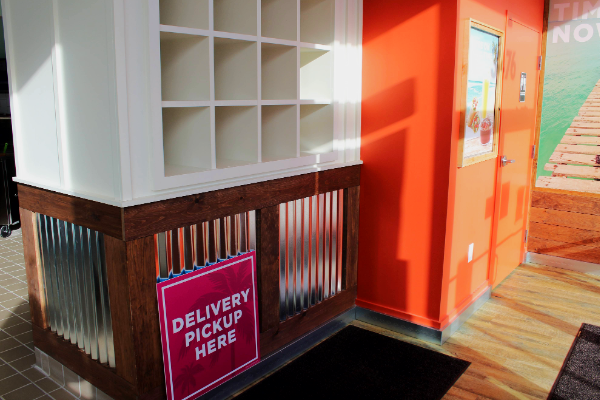 Completed front-of-house area with service counter and delivery order area.